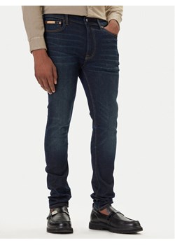 Calvin Klein Jeans Jeansy LV04RD718G Granatowy Skinny Fit ze sklepu MODIVO w kategorii Jeansy męskie - zdjęcie 186032976