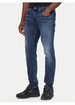 Tommy Jeans Jeansy DM0DM22247 Granatowy Slim Fit ze sklepu MODIVO w kategorii Jeansy męskie - zdjęcie 186200528