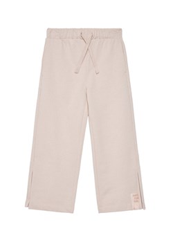 United Colors Of Benetton Spodnie dresowe 3NBMCF06K Różowy Relaxed Fit ze sklepu MODIVO w kategorii Spodnie dziewczęce - zdjęcie 186245457