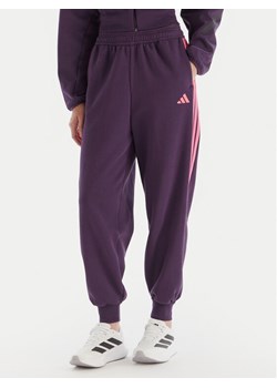 adidas Spodnie dresowe Tiro 3-Stripes JM9072 Fioletowy Loose Fit ze sklepu MODIVO w kategorii Spodnie damskie - zdjęcie 186294728