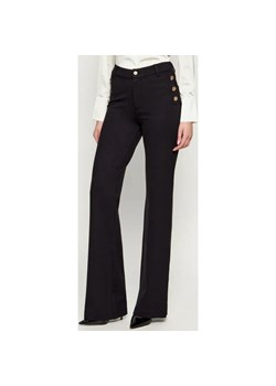 GUESS Spodnie CHRISSY | flare fit ze sklepu Gomez Fashion Store w kategorii Spodnie damskie - zdjęcie 186334968