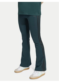 adidas Legginsy adicolor JV8617 Zielony Slim Fit ze sklepu MODIVO w kategorii Spodnie dziewczęce - zdjęcie 186345456