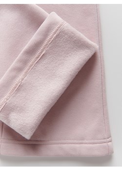 Reserved - Ocieplane spodnie flare - pastelowy róż ze sklepu Reserved w kategorii Spodnie dziewczęce - zdjęcie 186380405