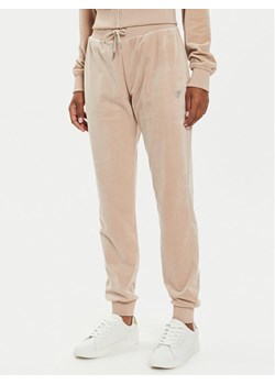 Guess Spodnie dresowe V3BB27 KBXI2 Beżowy Regular Fit - id: 0000304242472 - marki Guess - 186450428 Guess Spodnie dresowe V3BB27 KBXI2 Beżowy Regular Fit ze sklepu MODIVO w kategorii Spodnie damskie - zdjęcie 186450428