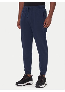 Rossignol Spodnie dresowe RLOMP12 Granatowy Regular Fit ze sklepu MODIVO w kategorii Spodnie męskie - zdjęcie 186504949