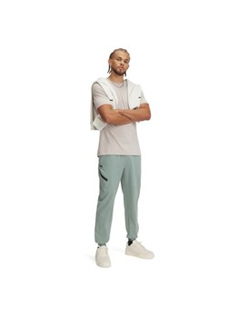 Męskie spodnie treningowe Under Armour UA Unstoppable Joggers - zielone ze sklepu Sportstylestory.com w kategorii Spodnie męskie - zdjęcie 186512226