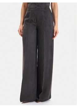 Guess Spodnie materiałowe W5YB02 WH5N2 Czarny Regular Fit ze sklepu MODIVO w kategorii Spodnie damskie - zdjęcie 186525415