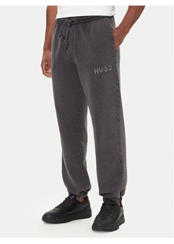 HUGO Spodnie dresowe Delwony 50546385 Szary Relaxed Fit ze sklepu MODIVO w kategorii Spodnie męskie - zdjęcie 186525575