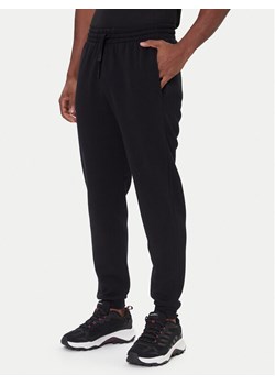 Rossignol Spodnie dresowe RLOMP12 Czarny Regular Fit ze sklepu MODIVO w kategorii Spodnie męskie - zdjęcie 186541426