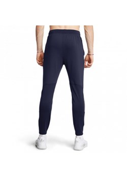 Męskie spodnie treningowe Under Armour UA Vanish Cw Fitted Pant - granatowe ze sklepu Sportstylestory.com w kategorii Spodnie męskie - zdjęcie 186547927