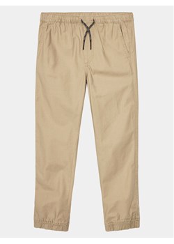 Gap Spodnie materiałowe 707988-03 Beżowy Regular Fit ze sklepu MODIVO w kategorii Spodnie chłopięce - zdjęcie 186584716