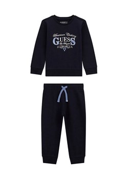 Guess Komplet dresowy N5YG14 KA6R0 Granatowy Regular Fit ze sklepu MODIVO w kategorii Komplety chłopięce - zdjęcie 186598756