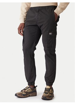 Tommy Jeans Spodnie materiałowe DM0DM22003 Szary Regular Fit ze sklepu MODIVO w kategorii Spodnie męskie - zdjęcie 186732425