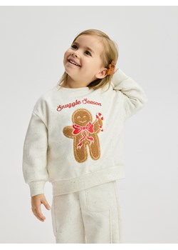 Reserved - Bluza ze świąteczną aplikacją - złamana biel - id: 598GT-01M - marki Reserved - 186800907 Reserved - Bluza ze świąteczną aplikacją - złamana biel ze sklepu Reserved w kategorii Bluzy dziewczęce - zdjęcie 186800907