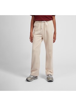 Spodnie dziecięce New Balance LAKG0216BIS – beżowe ze sklepu New Balance Poland w kategorii Spodnie dziewczęce - zdjęcie 187240419