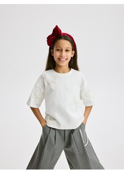 Reserved - T-shirt z kokardkami - złamana biel - id: 497FT-01X - marki Reserved - 187276816 Reserved - T-shirt z kokardkami - złamana biel ze sklepu Reserved w kategorii Bluzki dziewczęce - zdjęcie 187276816