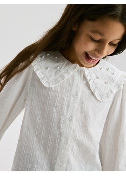 Reserved - Koszula z perłową aplikacją - złamana biel - id: 448FW-01X - marki Reserved - 187295935 Reserved - Koszula z perłową aplikacją - złamana biel ze sklepu Reserved w kategorii Bluzki dziewczęce - zdjęcie 187295935