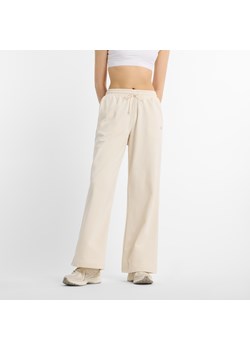 Spodnie damskie New Balance WP51503LIN – beżowe ze sklepu New Balance Poland w kategorii Spodnie damskie - zdjęcie 187331139