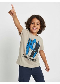 Sinsay - Bawełniana koszulka z nadrukiem Transformers - kremowy ze sklepu Sinsay w kategorii T-shirty chłopięce - zdjęcie 187333258