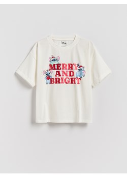Reserved - Świąteczny t-shirt Lilo i Stitch - złamana biel ze sklepu Reserved w kategorii Bluzki dziewczęce - zdjęcie 187334026