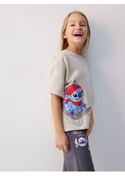 Reserved - Świąteczny t-shirt Lilo i Stitch - beżowy ze sklepu Reserved w kategorii Bluzki dziewczęce - zdjęcie 187334035