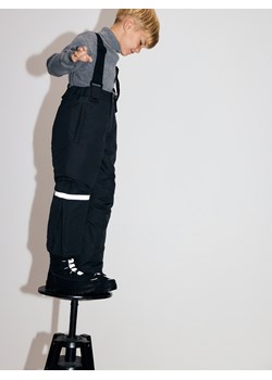 Reserved - Ocieplane spodnie na szelkach - czarny ze sklepu Reserved w kategorii Spodnie chłopięce - zdjęcie 187476417