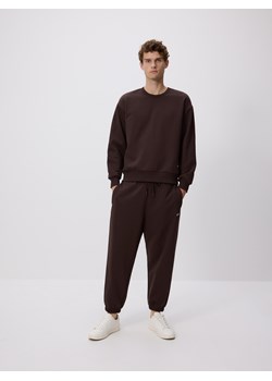 Reserved - Spodnie dresowe comfort fit - brązowy ze sklepu Reserved w kategorii Spodnie męskie - zdjęcie 187499536