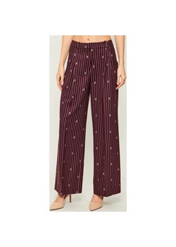 HUGO Spodnie Haviri | flare fit ze sklepu Gomez Fashion Store w kategorii Spodnie damskie - zdjęcie 187545129