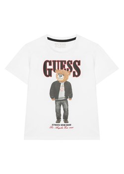 Guess T-Shirt L6RI11 K8HM4 Biały Regular Fit ze sklepu MODIVO w kategorii T-shirty chłopięce - zdjęcie 187588709