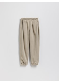 Reserved - Bawełniane spodnie jogger - beżowy ze sklepu Reserved w kategorii Spodnie chłopięce - zdjęcie 187634028