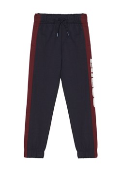 Guess Spodnie dresowe L6RB01 KA6R4 Granatowy Regular Fit ze sklepu MODIVO w kategorii Spodnie chłopięce - zdjęcie 187666925