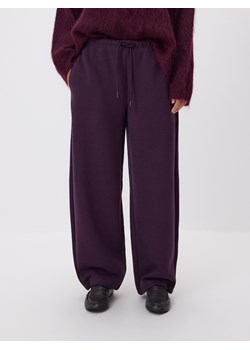 Reserved - Spodnie z dodatkiem wiskozy - ciemnofioletowy ze sklepu Reserved w kategorii Spodnie damskie - zdjęcie 187669627