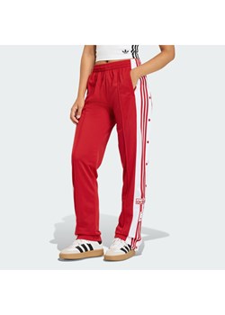 adidas Spodnie dresowe Adibreak KD6324 Czerwony Loose Fit ze sklepu MODIVO w kategorii Spodnie damskie - zdjęcie 187696258