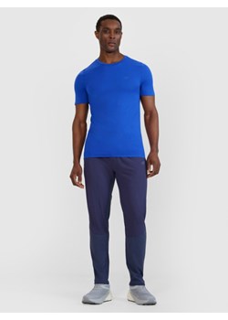 Męskie spodnie do biegania 4F 4FWSS25TFTRM0793 - granatowe ze sklepu Sportstylestory.com w kategorii Spodnie męskie - zdjęcie 187780706