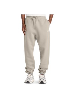 Spodnie męskie New Balance MP41503TWF - beżowe ze sklepu streetstyle24.pl w kategorii Spodnie męskie - zdjęcie 187781979