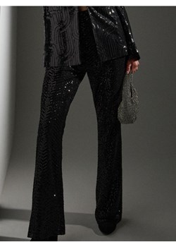 Sinsay - Spodnie dzwony z połyskującymi cekinami - czarny ze sklepu Sinsay w kategorii Spodnie damskie - zdjęcie 187799736