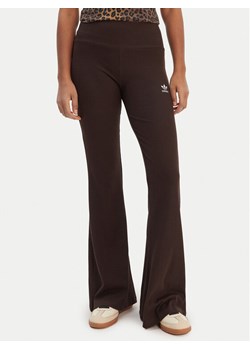 adidas Legginsy Essentials KD3849 Brązowy Flared Leg ze sklepu MODIVO w kategorii Spodnie damskie - zdjęcie 187803106