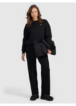 Damskie spodnie dresowe z szerokimi nogawkami 4F 4FRAW25TTROF1919 - czarne ze sklepu Sportstylestory.com w kategorii Spodnie damskie - zdjęcie 187821999