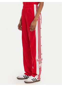 adidas Spodnie dresowe Adibreak KD6324 Czerwony Loose Fit ze sklepu MODIVO w kategorii Spodnie damskie - zdjęcie 187851726