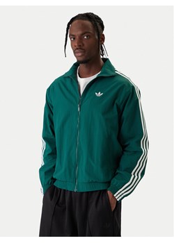 adidas Bluza Firebird KC8018 Zielony Regular Fit ze sklepu MODIVO w kategorii Bluzy męskie - zdjęcie 187851727