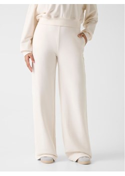 Guess Spodnie materiałowe 180561 Biały Slim Fit ze sklepu MODIVO w kategorii Spodnie damskie - zdjęcie 187924668