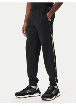 EA7 Emporio Armani Spodnie dresowe 7M001482 AF12660 UC001 Czarny Regular Fit ze sklepu MODIVO w kategorii Spodnie męskie - zdjęcie 187934189