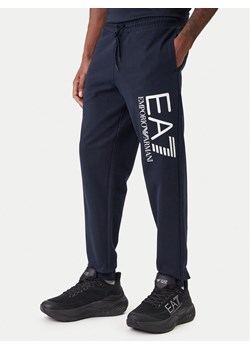 EA7 Emporio Armani Spodnie dresowe 7M001415 AF22266 UB102 Granatowy Regular Fit ze sklepu MODIVO w kategorii Spodnie męskie - zdjęcie 187938227