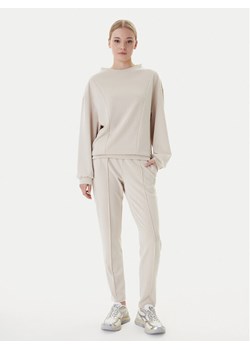 EA7 Emporio Armani Dres 7W000194 AF12643 U1088 Beżowy Relaxed Fit ze sklepu MODIVO w kategorii Dresy damskie - zdjęcie 187946996