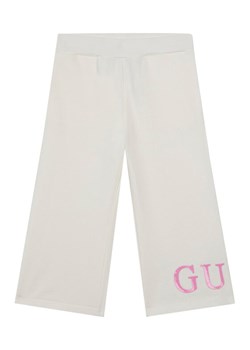 Guess Spodnie dresowe K6RB01 KA6R4 Biały Regular Fit ze sklepu MODIVO w kategorii Spodnie dziewczęce - zdjęcie 187964425
