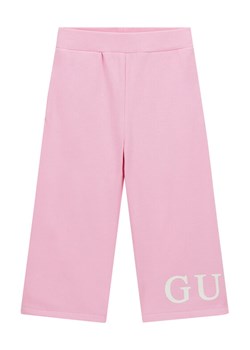Guess Spodnie dresowe K6RB01 KA6R4 Różowy Regular Fit ze sklepu MODIVO w kategorii Spodnie dziewczęce - zdjęcie 187966809