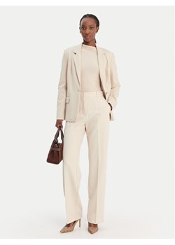 Guess Marynarka W6RN54 KCMU2 Beżowy Regular Fit ze sklepu MODIVO w kategorii Marynarki damskie - zdjęcie 188030185