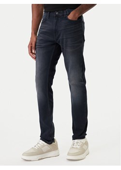 HUGO Jeansy 50555175 Granatowy Extra Slim Fit ze sklepu MODIVO w kategorii Jeansy męskie - zdjęcie 188051595