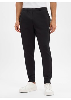 Lacoste Spodnie dresowe Mężczyźni czarny jednolity ze sklepu vangraaf w kategorii Spodnie męskie - zdjęcie 188055595