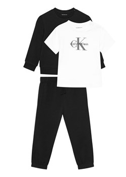 Calvin Klein Jeans T-Shirt Monogram IN0IN00336 Czarny Regular Fit ze sklepu MODIVO w kategorii T-shirty chłopięce - zdjęcie 188074666